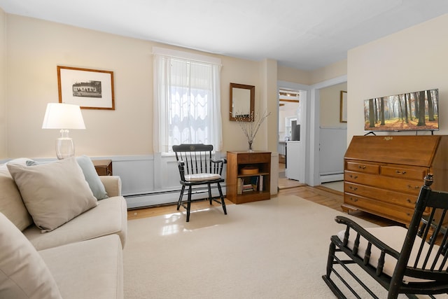 interior space featuring wood finished floors and a baseboard radiator