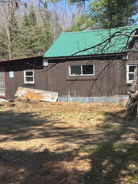 357 Leeds Rd, Wayne, ME 04284 - view of property exterior featuring metal roof