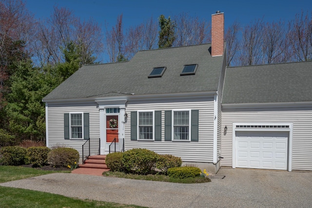 43 Sylvan Way Unit 10, Wells, ME 04090 - new england style home with a garage, a chimney, and roof with shingles