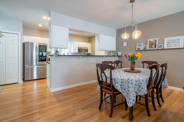 43 Sylvan Way Unit 10, Wells, ME 04090 - dining area with light wood-style floors, recessed lighting, and baseboards