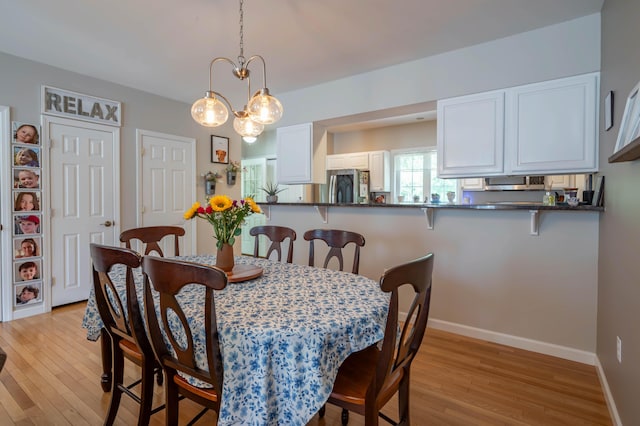 43 Sylvan Way Unit 10, Wells, ME 04090 - dining room featuring light wood-style flooring and baseboards