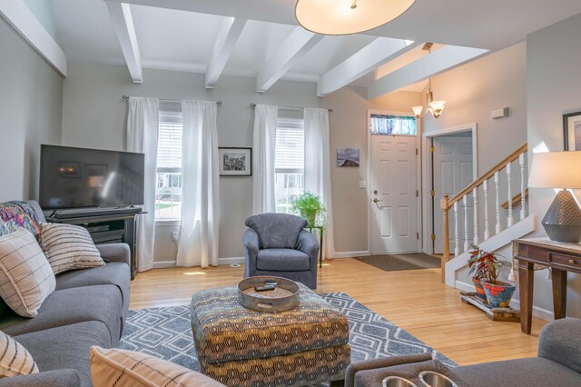43 Sylvan Way Unit 10, Wells, ME 04090 - living room with beam ceiling, stairway, wood finished floors, and baseboards