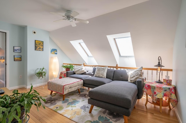 43 Sylvan Way Unit 10, Wells, ME 04090 - living area featuring a skylight, light wood-style floors, ceiling fan, lofted ceiling, and baseboards