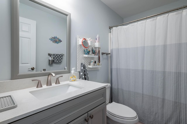 43 Sylvan Way Unit 10, Wells, ME 04090 - bathroom featuring vanity, toilet, and a shower with curtain