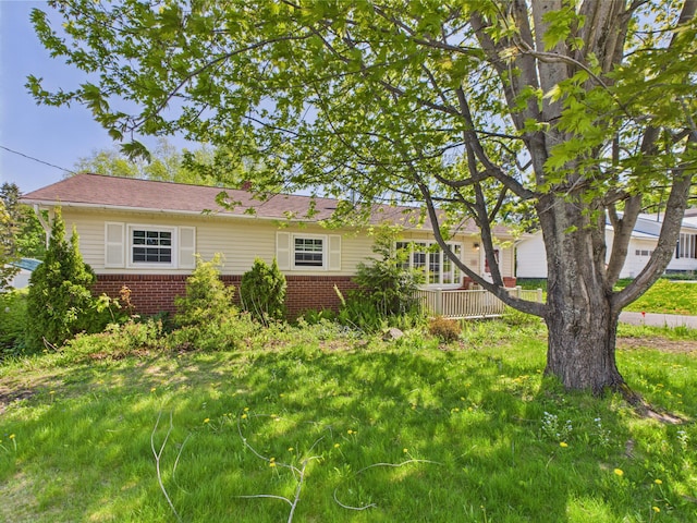 80 Garden Cir, Caribou, ME 04736 - view of property exterior featuring brick siding and a garage