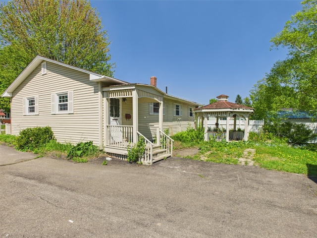80 Garden Cir, Caribou, ME 04736 - view of front facade with a gazebo and a chimney