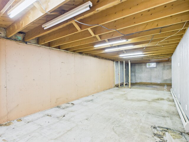 80 Garden Cir, Caribou, ME 04736 - unfinished basement with a baseboard radiator
