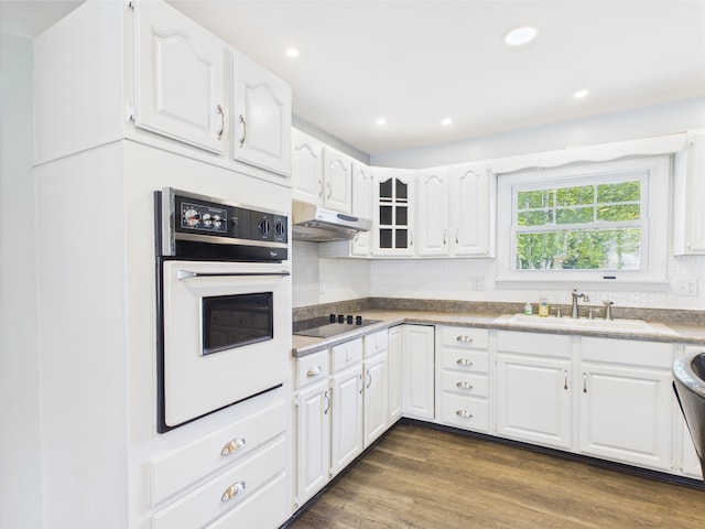 80 Garden Cir, Caribou, ME 04736 - kitchen with a sink, oven, black electric stovetop, white cabinets, and under cabinet range hood