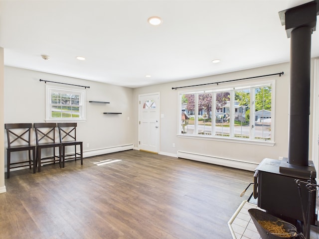 80 Garden Cir, Caribou, ME 04736 - foyer featuring a baseboard heating unit, plenty of natural light, wood finished floors, recessed lighting, and baseboards