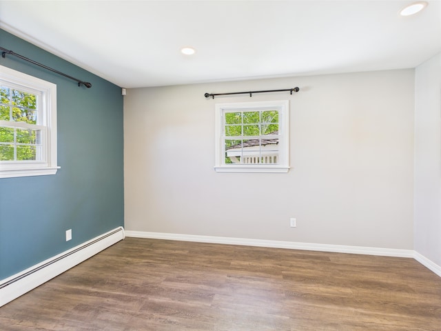 80 Garden Cir, Caribou, ME 04736 - empty room featuring a baseboard heating unit, wood finished floors, baseboards, and recessed lighting