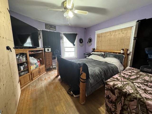 bedroom featuring a ceiling fan and hardwood / wood-style floors