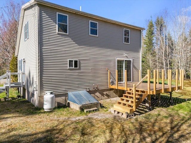 back of property with a wooden deck