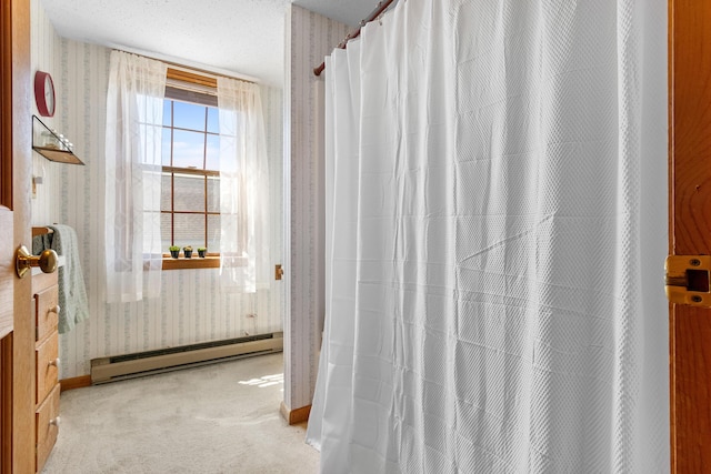 full bathroom featuring baseboards, wallpapered walls, and baseboard heating