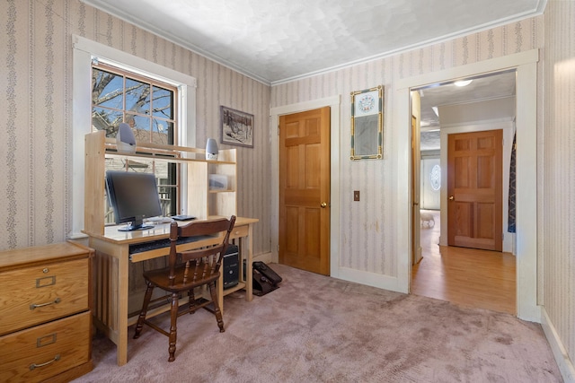 office with crown molding, wallpapered walls, carpet floors, and baseboards
