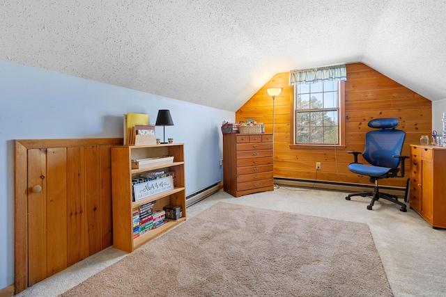 home office with wooden walls, a baseboard radiator, carpet, and vaulted ceiling