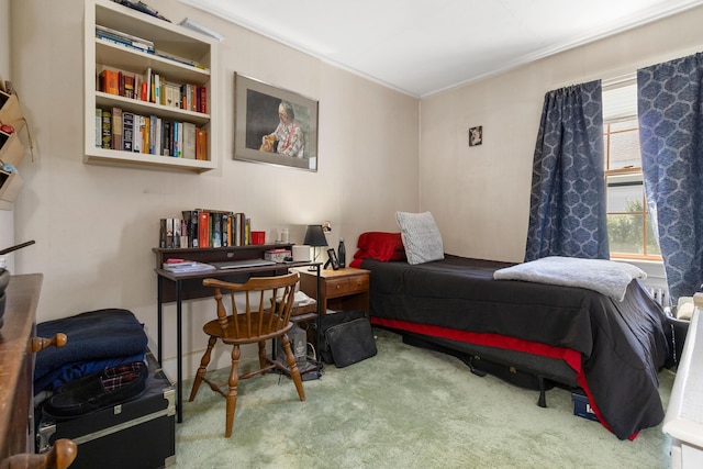 bedroom featuring carpet flooring and ornamental molding
