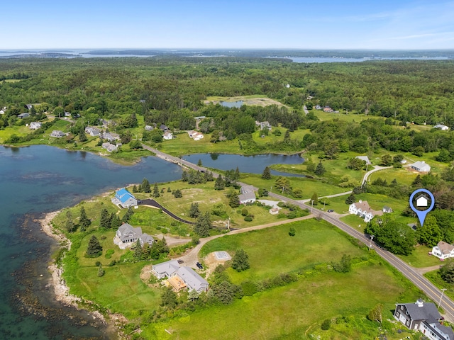 bird's eye view with a forest view and a water view