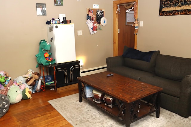 12 Sherwin St, Waterville, ME 04901 - living room featuring a baseboard heating unit and wood finished floors