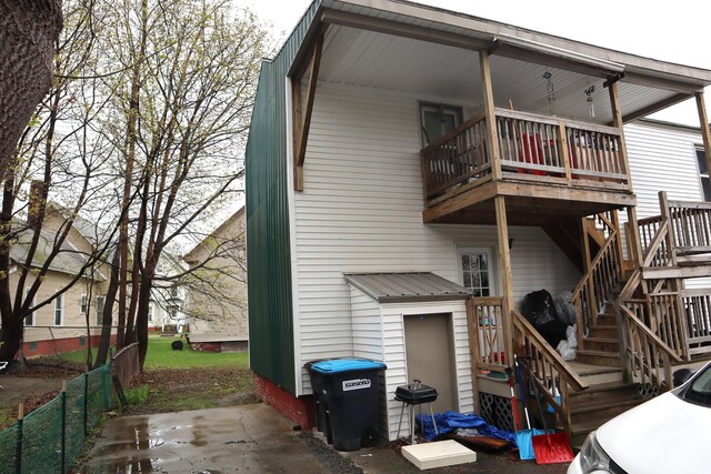12 Sherwin St, Waterville, ME 04901 - rear view of house with fence, a wooden deck, stairs, and a balcony