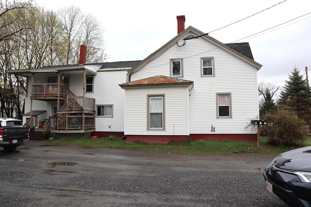 12 Sherwin St, Waterville, ME 04901 - back of house featuring stairway and a chimney