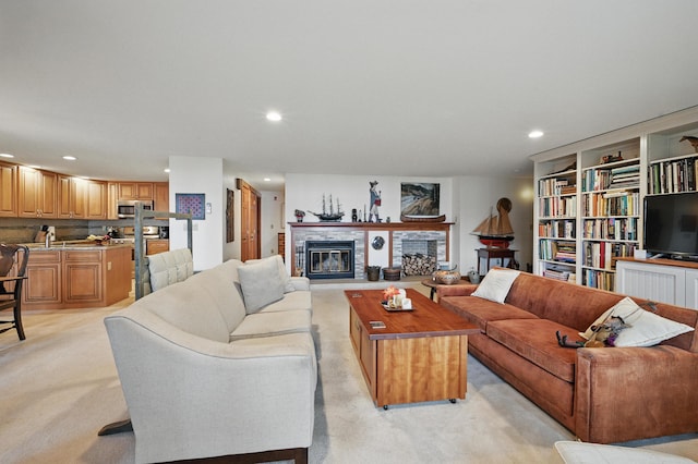 39 Turtle Run Rd Unit 8, Winthrop, ME 04364 - living area with a glass covered fireplace, recessed lighting, and light colored carpet