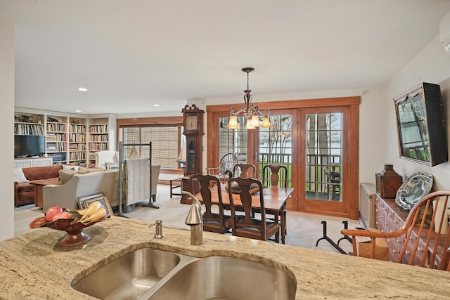 39 Turtle Run Rd Unit 8, Winthrop, ME 04364 - dining room featuring light carpet, a healthy amount of sunlight, an inviting chandelier, and recessed lighting