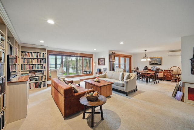 39 Turtle Run Rd Unit 8, Winthrop, ME 04364 - living room featuring a wall mounted AC, a notable chandelier, recessed lighting, and light colored carpet
