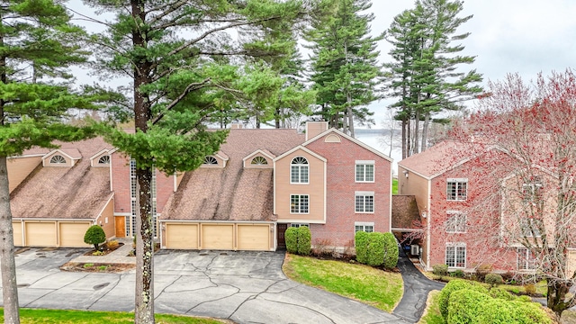 39 Turtle Run Rd Unit 8, Winthrop, ME 04364 - traditional home featuring a chimney, driveway, brick siding, and a garage