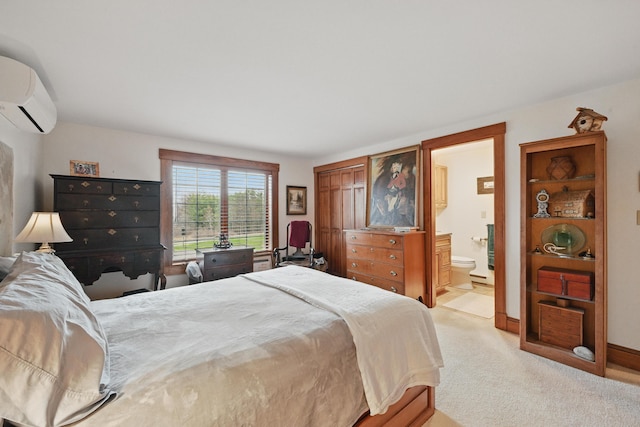 39 Turtle Run Rd Unit 8, Winthrop, ME 04364 - bedroom with ensuite bathroom, light colored carpet, and an AC wall unit