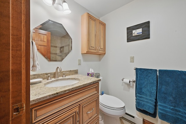 39 Turtle Run Rd Unit 8, Winthrop, ME 04364 - bathroom featuring toilet, vanity, and a baseboard heating unit