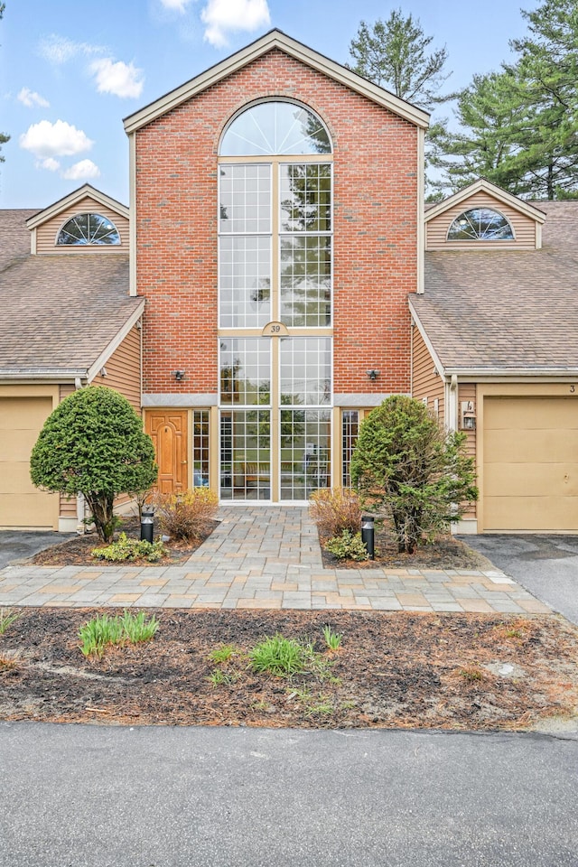 39 Turtle Run Rd Unit 8, Winthrop, ME 04364 - exterior space with an attached garage, brick siding, and aphalt driveway