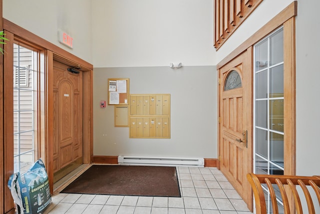 39 Turtle Run Rd Unit 8, Winthrop, ME 04364 - entrance foyer with light tile patterned floors, baseboard heating, a high ceiling, and mail area