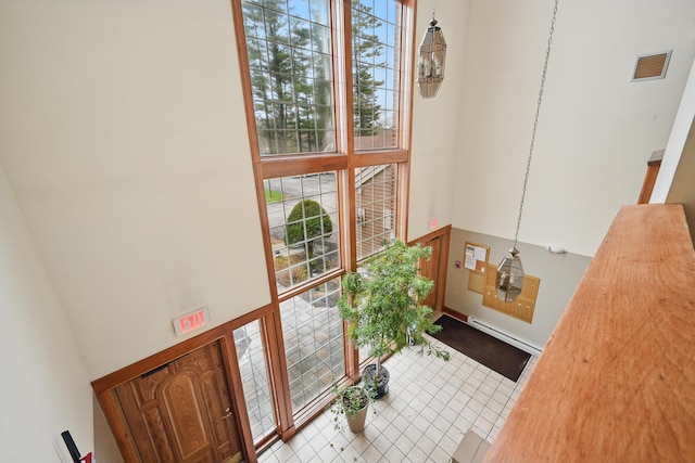 39 Turtle Run Rd Unit 8, Winthrop, ME 04364 - entryway with visible vents, a baseboard radiator, and a high ceiling