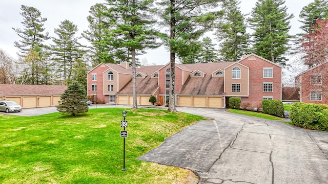 39 Turtle Run Rd Unit 8, Winthrop, ME 04364 - view of front facade featuring driveway, a garage, and a front yard
