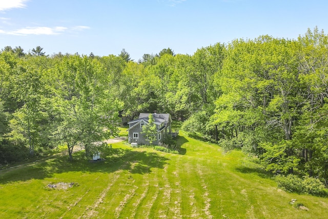 birds eye view of property with a wooded view
