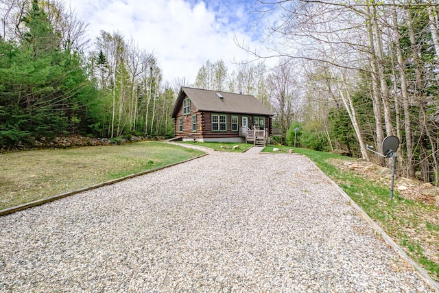 26 Mountain View Ln, Woodstock, ME 04219 - cabin with driveway, a wooden deck, a front lawn, and log exterior