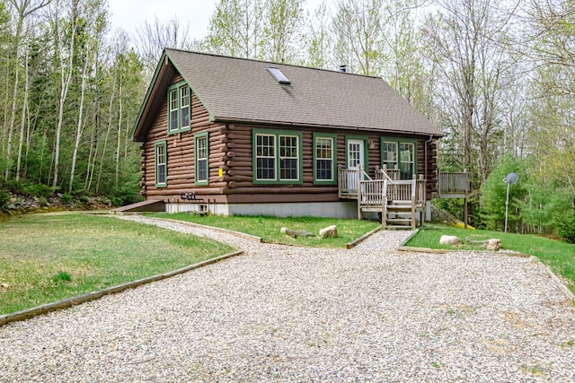 26 Mountain View Ln, Woodstock, ME 04219 - back of property with a yard, a shingled roof, and log siding