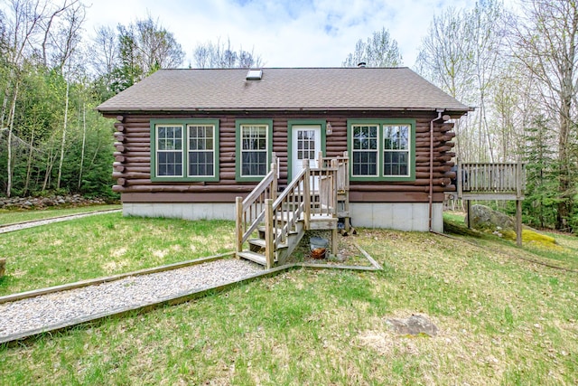 26 Mountain View Ln, Woodstock, ME 04219 - back of house with a yard, roof with shingles, and log siding