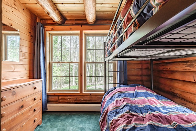 26 Mountain View Ln, Woodstock, ME 04219 - carpeted bedroom with beamed ceiling, a baseboard radiator, wood walls, and wooden ceiling