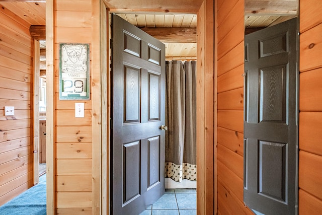 26 Mountain View Ln, Woodstock, ME 04219 - hall with wood ceiling, wooden walls, and light tile patterned floors