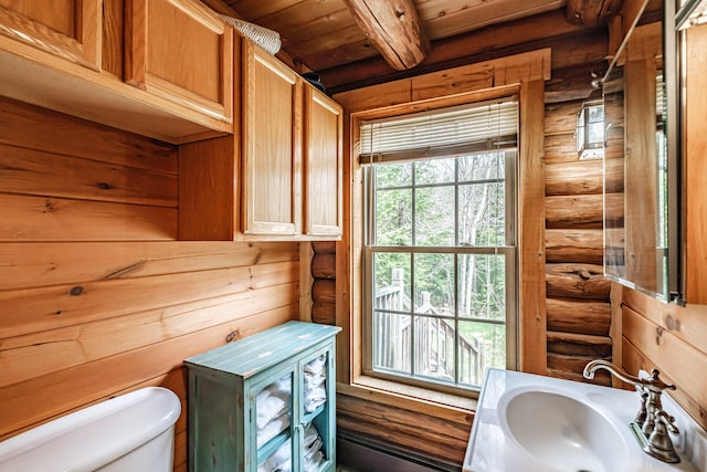 26 Mountain View Ln, Woodstock, ME 04219 - half bathroom featuring a sink, toilet, log walls, beamed ceiling, and wood ceiling