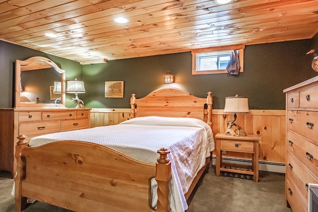 26 Mountain View Ln, Woodstock, ME 04219 - carpeted bedroom with wood ceiling, a wainscoted wall, wooden walls, a baseboard radiator, and recessed lighting