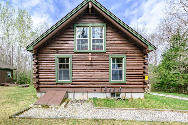 26 Mountain View Ln, Woodstock, ME 04219 - view of home's exterior featuring log siding and a yard