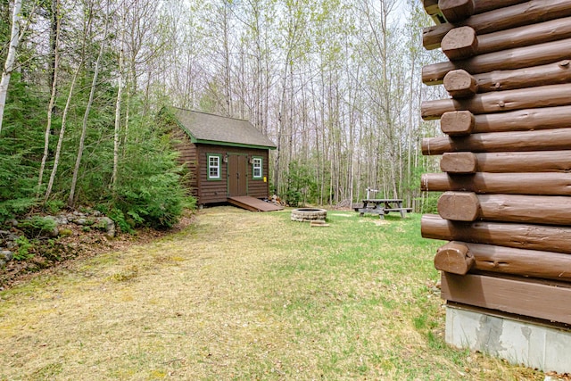 26 Mountain View Ln, Woodstock, ME 04219 - view of yard with an outdoor fire pit and an outbuilding