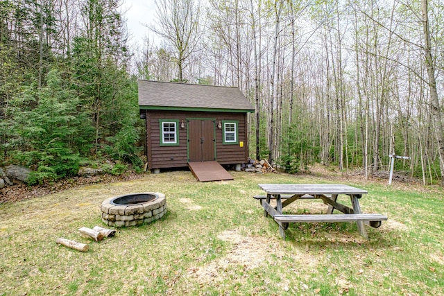 26 Mountain View Ln, Woodstock, ME 04219 - view of yard with a fire pit, an outdoor structure, and a storage unit