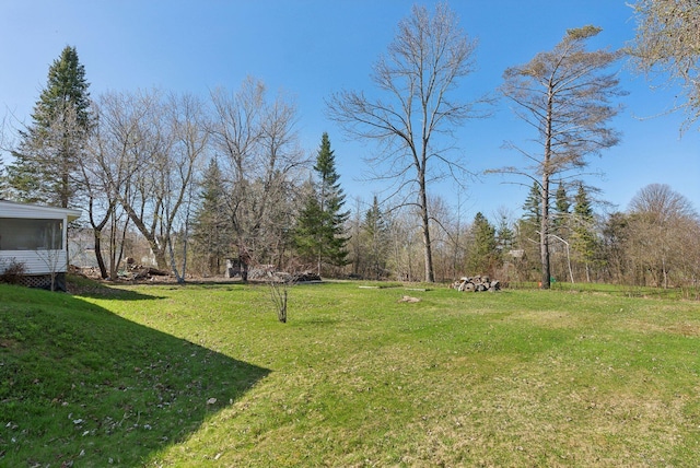 232 Peltoma Ave, Pittsfield, ME 04967 - view of green lawn with a sunroom