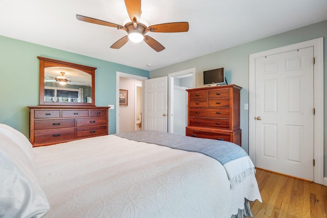 bedroom featuring light wood-style flooring and ceiling fan