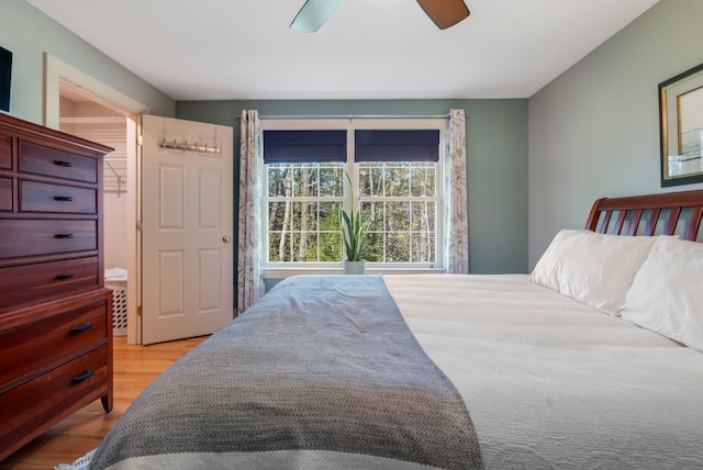 bedroom with wood finished floors and a ceiling fan