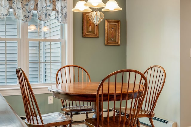 dining space with baseboard heating and a healthy amount of sunlight
