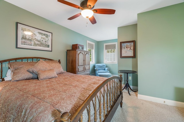 carpeted bedroom featuring ceiling fan and baseboards